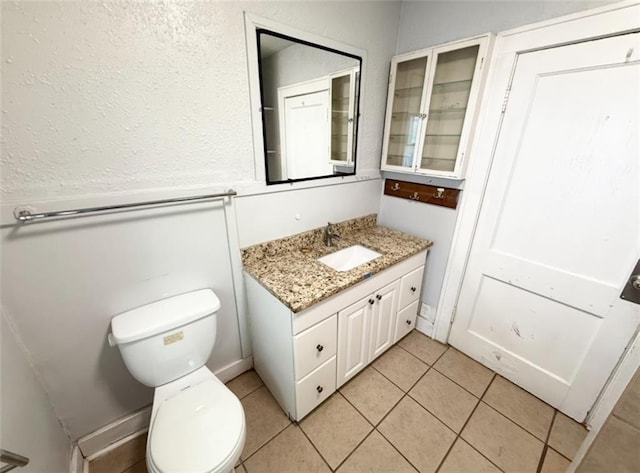7216 Indiana Ave, Kansas City, MO 64132 - bathroom featuring vanity, toilet, and tile patterned flooring