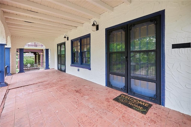918 W 32nd Ter, Kansas City, MO 64111 - view of patio featuring french doors