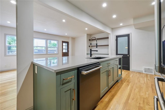 918 W 32nd Ter, Kansas City, MO 64111 - kitchen featuring stainless steel dishwasher, a sink, green cabinetry, light countertops, and recessed lighting
