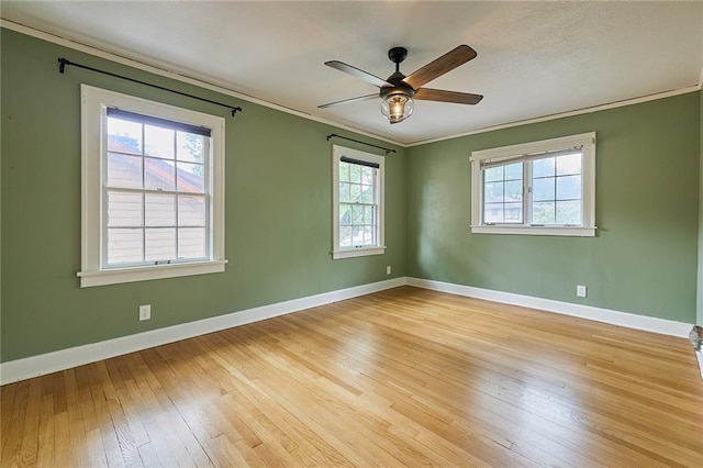 918 W 32nd Ter, Kansas City, MO 64111 - spare room featuring crown molding, light wood-style floors, baseboards, and a ceiling fan