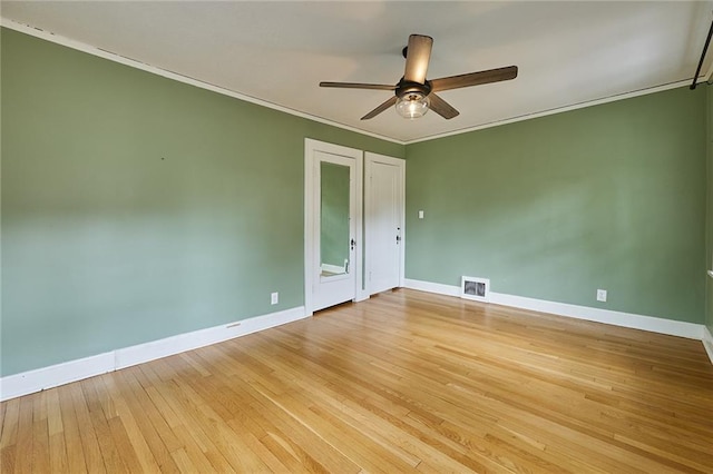 918 W 32nd Ter, Kansas City, MO 64111 - empty room with a ceiling fan, baseboards, light wood-style floors, and ornamental molding