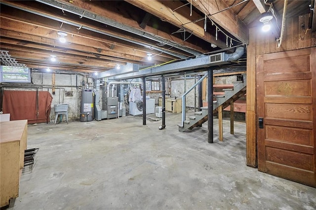 918 W 32nd Ter, Kansas City, MO 64111 - below grade area featuring gas water heater, stairs, and heating unit