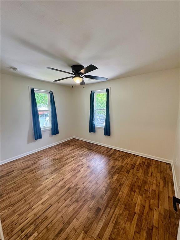 908 N 8th St, Lansing, KS 66043 - spare room with wood finished floors, healthy amount of natural light, and a ceiling fan