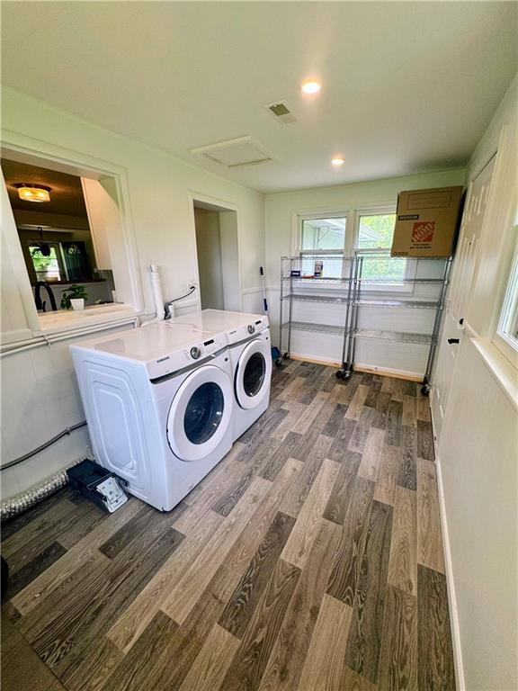 908 N 8th St, Lansing, KS 66043 - washroom with independent washer and dryer, dark wood-style flooring, attic access, and recessed lighting