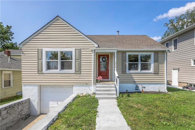 1212 Everett Ave, Kansas City, KS 66102 - bungalow featuring an attached garage, a front lawn, and a shingled roof