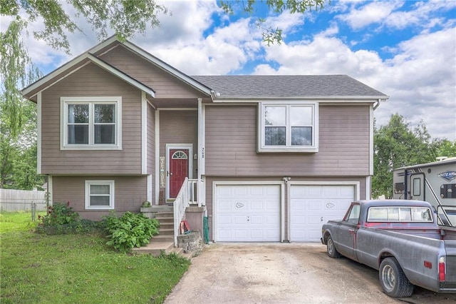 208 N Ohio St, Archie, MO 64725 - bi-level home with a garage and concrete driveway