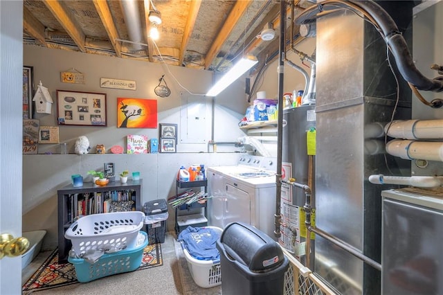 208 N Ohio St, Archie, MO 64725 - laundry area featuring washer and dryer and heating unit
