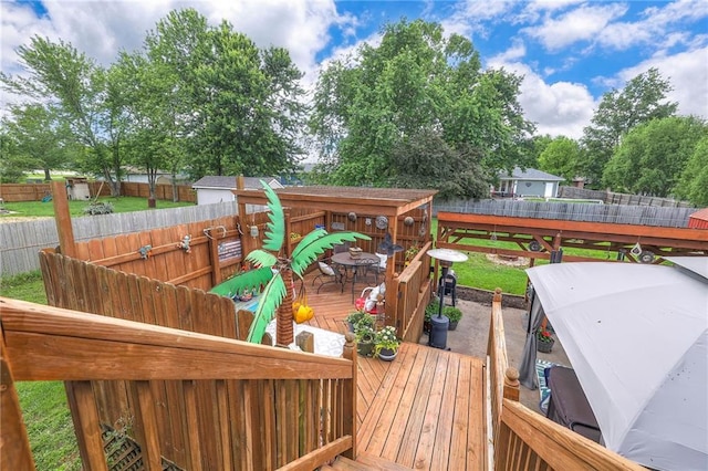 208 N Ohio St, Archie, MO 64725 - wooden deck with outdoor dining area and a fenced backyard