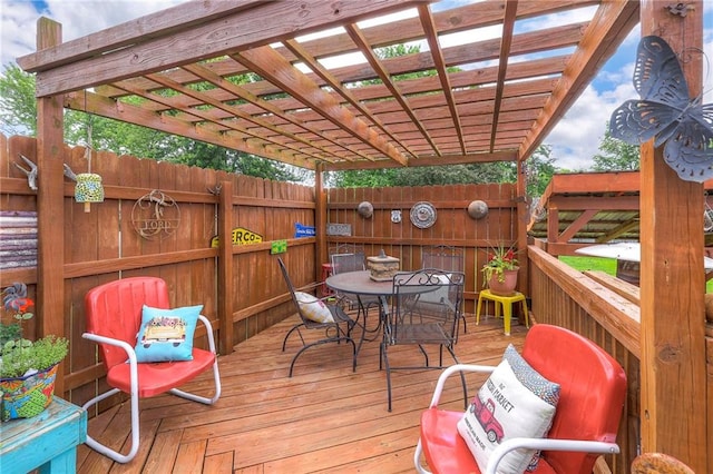 208 N Ohio St, Archie, MO 64725 - wooden terrace featuring outdoor dining space and a pergola
