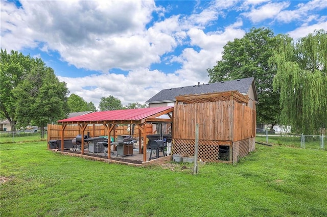 208 N Ohio St, Archie, MO 64725 - rear view of house with a patio