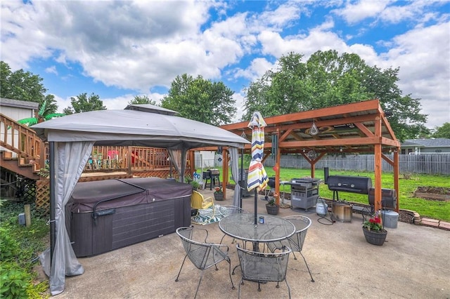 208 N Ohio St, Archie, MO 64725 - fenced backyard with a hot tub, a gazebo, and a patio area