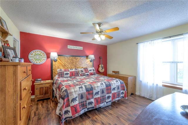 208 N Ohio St, Archie, MO 64725 - bedroom featuring wood finished floors, a textured ceiling, a ceiling fan, and baseboards