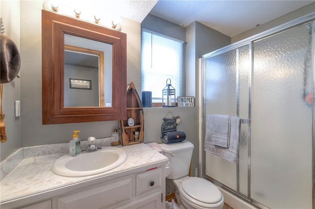 208 N Ohio St, Archie, MO 64725 - bathroom featuring vanity, toilet, a stall shower, and a textured ceiling