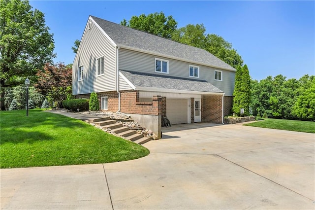 1908 Pine Ridge Dr, Leavenworth, KS 66048 - view of front of property featuring brick siding, driveway, a front lawn, and an attached garage