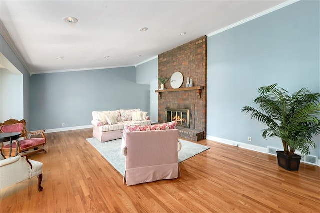 1908 Pine Ridge Dr, Leavenworth, KS 66048 - living area with light wood-type flooring, ornamental molding, and a brick fireplace