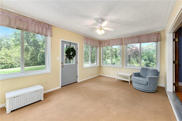 1908 Pine Ridge Dr, Leavenworth, KS 66048 - unfurnished room with radiator heating unit, plenty of natural light, ceiling fan, a textured ceiling, and carpet floors