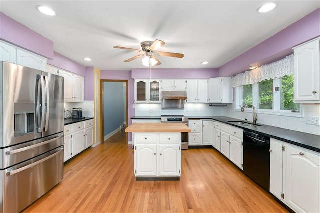 1908 Pine Ridge Dr, Leavenworth, KS 66048 - kitchen with stainless steel appliances, butcher block countertops, under cabinet range hood, a ceiling fan, and white cabinets