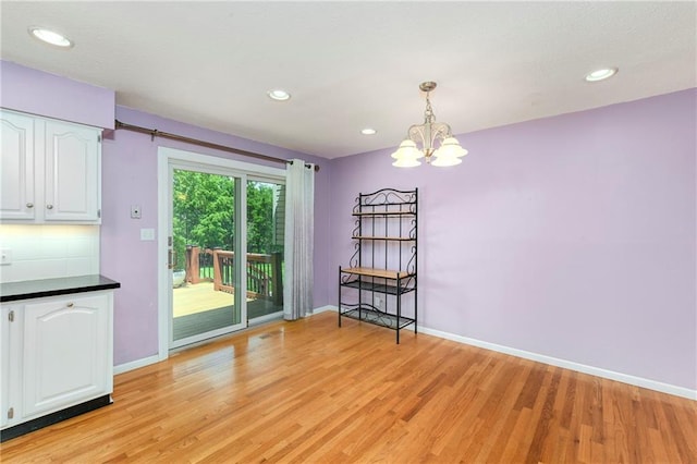 1908 Pine Ridge Dr, Leavenworth, KS 66048 - unfurnished dining area with a chandelier, light wood-style floors, and recessed lighting