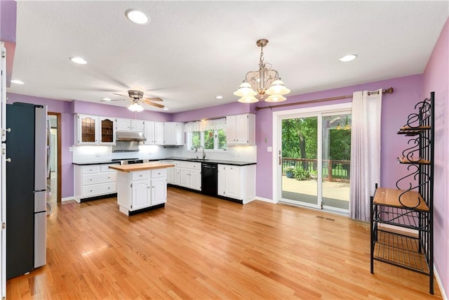 1908 Pine Ridge Dr, Leavenworth, KS 66048 - kitchen with dishwasher, white cabinets, a center island, light wood-style flooring, and recessed lighting