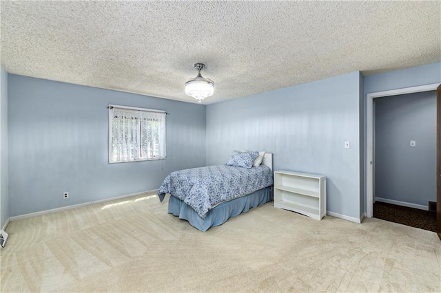 1908 Pine Ridge Dr, Leavenworth, KS 66048 - carpeted bedroom featuring baseboards and a textured ceiling