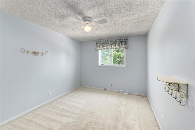1908 Pine Ridge Dr, Leavenworth, KS 66048 - unfurnished room featuring a textured ceiling, a ceiling fan, and carpet