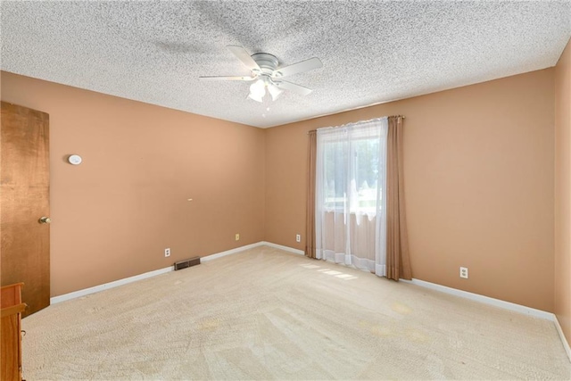 1908 Pine Ridge Dr, Leavenworth, KS 66048 - unfurnished room featuring a ceiling fan, carpet, and a textured ceiling