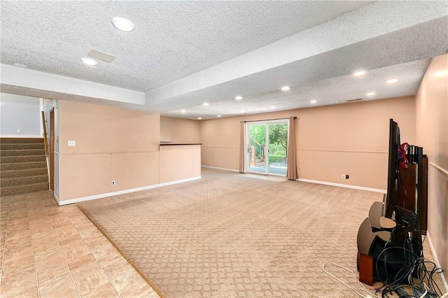 1908 Pine Ridge Dr, Leavenworth, KS 66048 - below grade area featuring a textured ceiling, recessed lighting, stairway, and carpet flooring