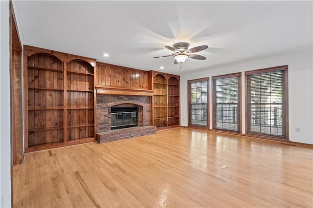 8541 Oakview Dr, Lenexa, KS 66215 - unfurnished living room with a ceiling fan, light wood finished floors, a fireplace, built in shelves, and recessed lighting