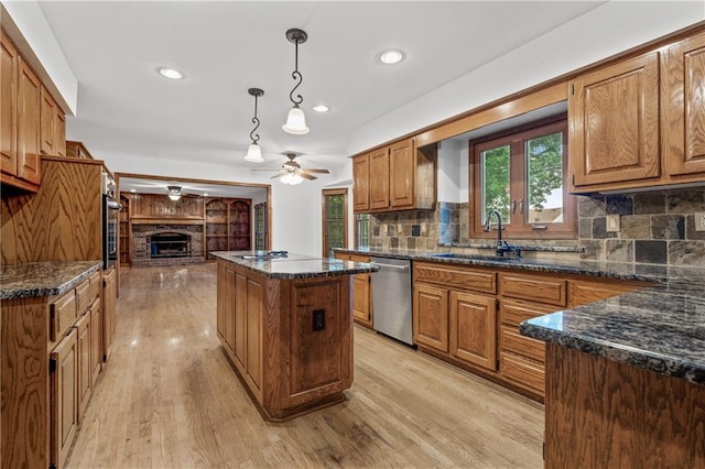 8541 Oakview Dr, Lenexa, KS 66215 - kitchen featuring dishwasher, a center island, ceiling fan, light wood finished floors, and recessed lighting