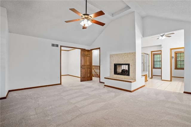 8541 Oakview Dr, Lenexa, KS 66215 - unfurnished living room featuring ceiling fan, light colored carpet, high vaulted ceiling, a multi sided fireplace, and a textured ceiling