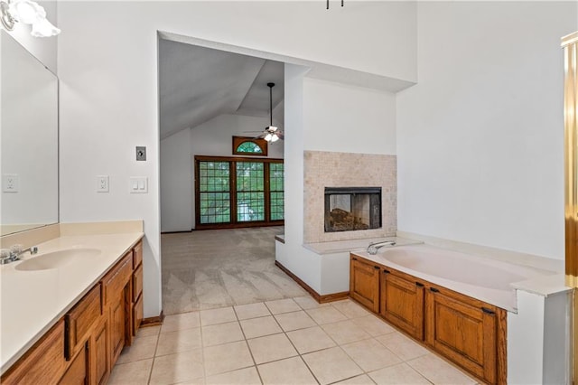 8541 Oakview Dr, Lenexa, KS 66215 - full bathroom with ceiling fan, vanity, a multi sided fireplace, lofted ceiling, and a bath