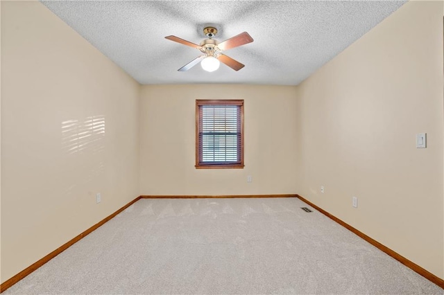 8541 Oakview Dr, Lenexa, KS 66215 - unfurnished room with a textured ceiling, ceiling fan, and light colored carpet
