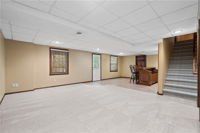 8541 Oakview Dr, Lenexa, KS 66215 - basement with a paneled ceiling, stairway, light carpet, bar, and recessed lighting