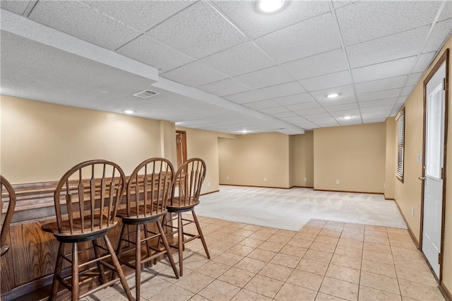 8541 Oakview Dr, Lenexa, KS 66215 - dining room featuring light carpet, a dry bar, light tile patterned floors, a drop ceiling, and recessed lighting