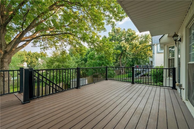 8541 Oakview Dr, Lenexa, KS 66215 - wooden terrace featuring view of wooded area