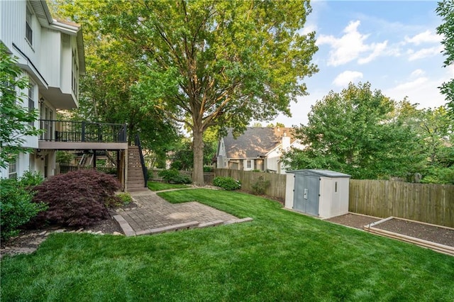 8541 Oakview Dr, Lenexa, KS 66215 - fenced backyard with a storage shed, stairs, a deck, and a patio area