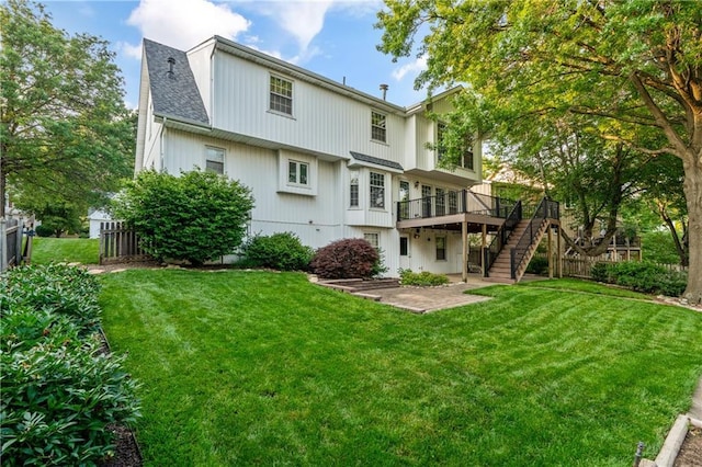 8541 Oakview Dr, Lenexa, KS 66215 - rear view of house with a wooden deck, stairway, a patio area, and roof with shingles