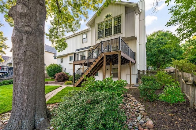 8541 Oakview Dr, Lenexa, KS 66215 - back of property featuring stairway and a wooden deck