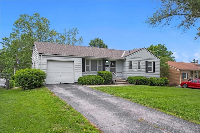 3501 N Delaware St, Independence, MO 64050 - ranch-style home featuring an attached garage, driveway, a front lawn, and a shingled roof