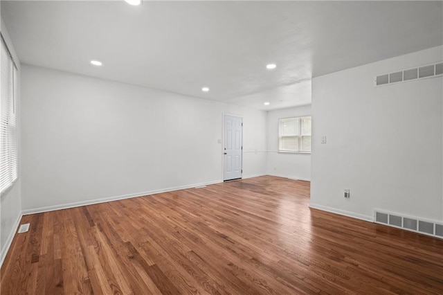 3501 N Delaware St, Independence, MO 64050 - empty room with wood finished floors, recessed lighting, and baseboards