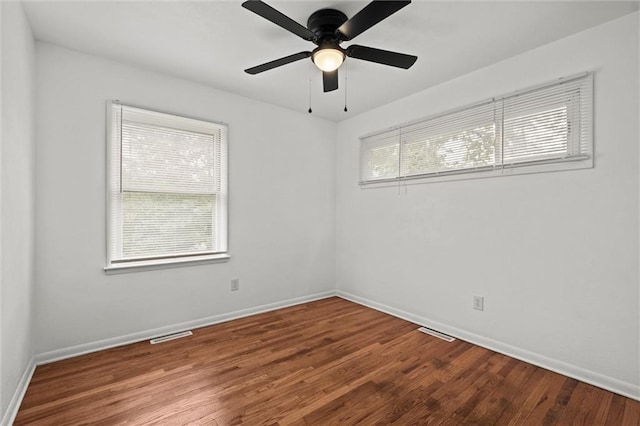 3501 N Delaware St, Independence, MO 64050 - empty room featuring wood finished floors, baseboards, and a ceiling fan