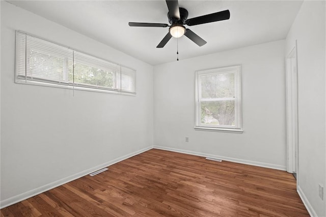 3501 N Delaware St, Independence, MO 64050 - empty room with wood finished floors, baseboards, and ceiling fan