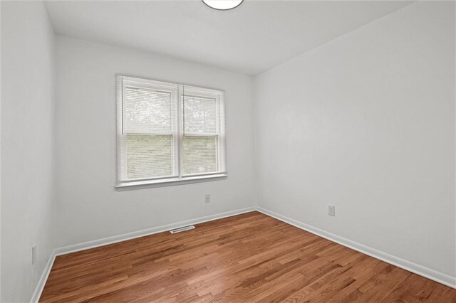 3501 N Delaware St, Independence, MO 64050 - spare room featuring light wood-style flooring and baseboards