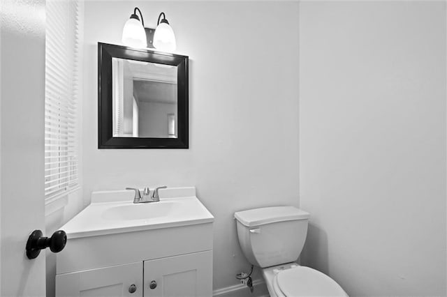 3501 N Delaware St, Independence, MO 64050 - half bathroom with toilet, vanity, and baseboards
