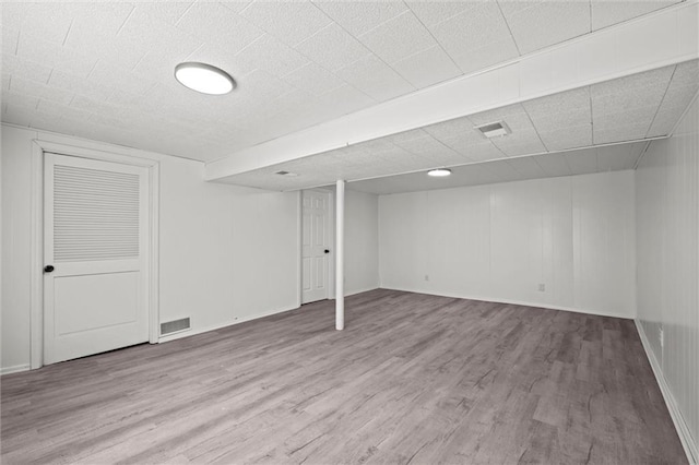 3501 N Delaware St, Independence, MO 64050 - finished basement with wood finished floors and baseboards