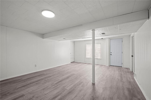 3501 N Delaware St, Independence, MO 64050 - below grade area featuring wood finished floors and baseboards
