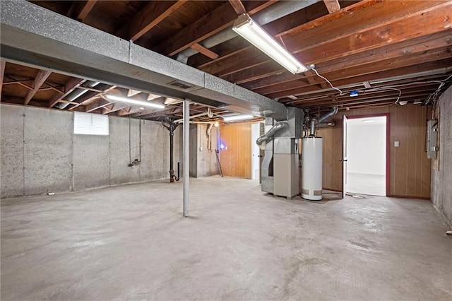 3501 N Delaware St, Independence, MO 64050 - below grade area featuring water heater, electric panel, and heating unit