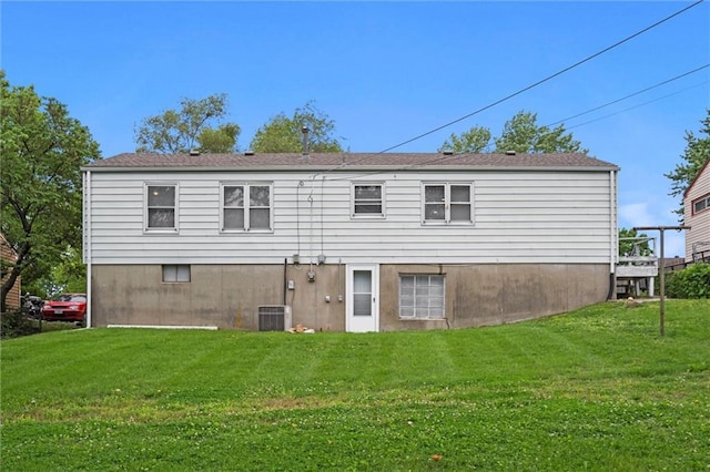 3501 N Delaware St, Independence, MO 64050 - rear view of property featuring cooling unit and a lawn