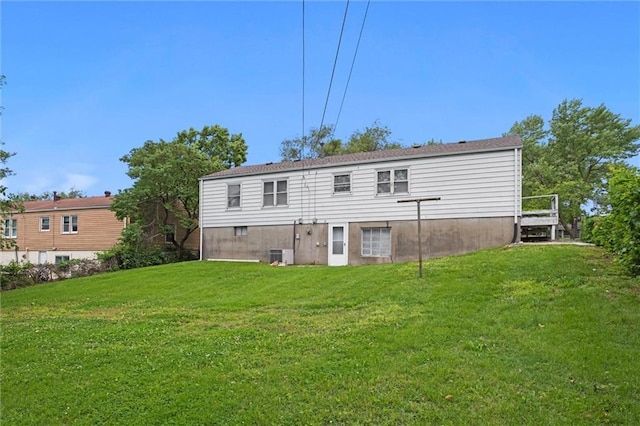 3501 N Delaware St, Independence, MO 64050 - rear view of property featuring a yard and central AC unit