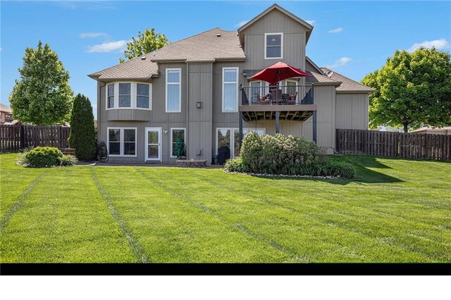 4307 N 110th Ter, Kansas City, KS 66109 - rear view of house with a balcony and a shingled roof